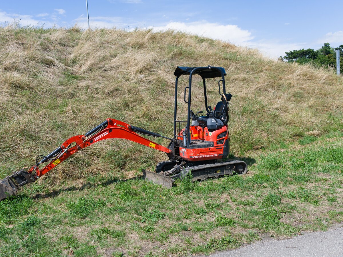 Compact excavator with the boom extended